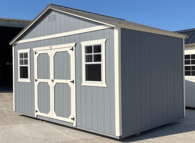 Well-built storage shed protecting lawn equipment from rain, humidity, and outdoor clutter