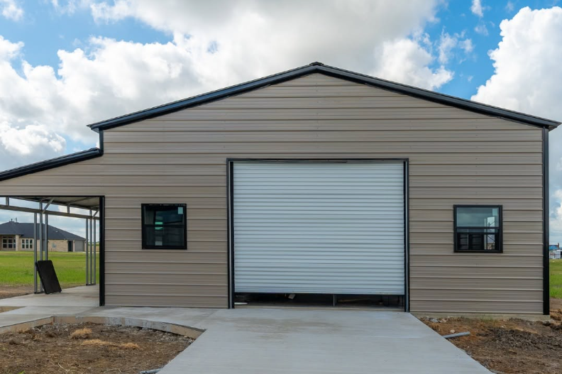 Steel building frame and enclosed workspace showing durable construction and organized access, Experienced Shed Builder aligning roof trusses on a custom storage shed frame